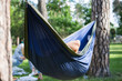 © Hennadii - Young guy has a rest in summer in a hammock