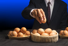 Smart Businessman Allocate Egg Into Many Baskets . Do Not Put All Eggs In One Basket 