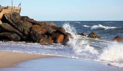 Waves crashing the rocks on the beach