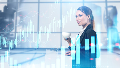 Woman with coffee in office, financial chart