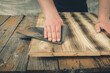 sandpaper wood processing process/male hands sandpaper processing wood