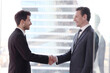 © alotofpeople - Business people shaking hands