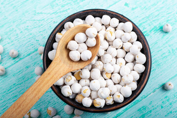 Wall Mural - white dry chickpeas in a plate