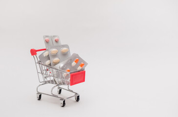 metal cart with tablets on a white isolated background with space for text.