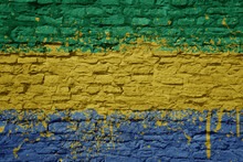 Painted Big National Flag Of Gabon On A Massive Old Brick Wall