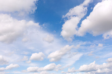 White clouds on blue sky background.