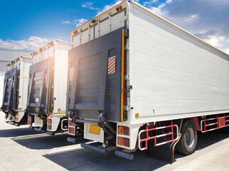 Rear of door hydraulic lift truck on parking at the warehouse. Cargo freight truck transport and logistics.