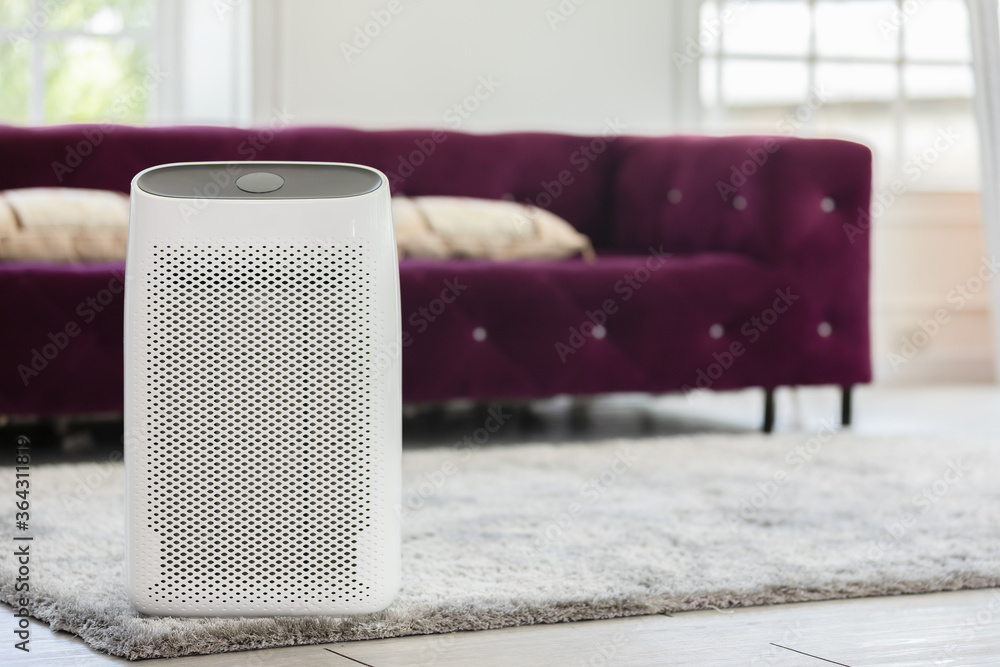 Air purifier in cozy white Living room for filter and cleaning dust