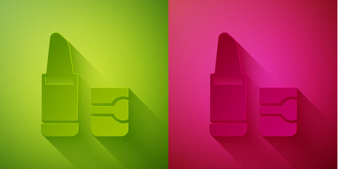 Wall Mural - Paper cut Lipstick icon isolated on green and pink background. Paper art style. Vector.