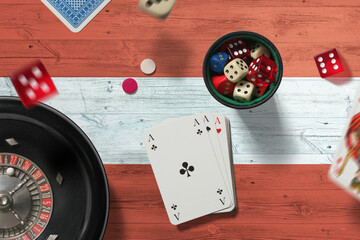 Austria casino theme. Aces in poker game, cards and chips on red table with national flag background. Gambling and betting.