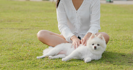 Woman play with her dog at park