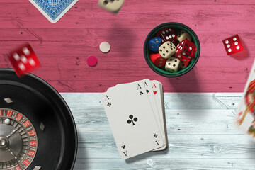 Monaco casino theme. Aces in poker game, cards and chips on red table with national flag background. Gambling and betting.