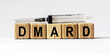 © Stanislau - Text DMARD made from wooden cubes. White background