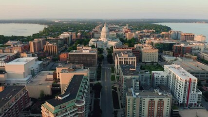 Wall Mural - Aerial overhead view of street leading to Madison city center and capitol building. Warm sunset light