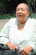 African american female senior dressed going to church.