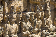 Close Detail Of A Textured Fragment Of The Reliefs On The Stone Walls Of The Buddhist Temple Of Borobudur In Indonesia Asia During A Sunny Day
