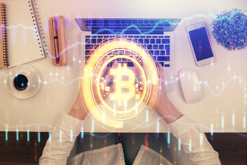 Double exposure of woman hands working on computer and blockchain theme hologram drawing. Top View. bitcoin cryptocurrency concept.