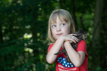 Wall Mural - Little girl and kitten