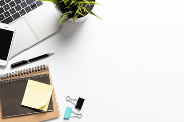 Top View office desk with computer,smartphone and office supplies with copy space