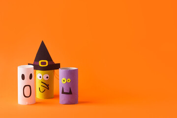 Wall Mural - Halloween toy collection on orange for Halloween party concept background. Paper crafts, easy DIY. Handcraft creative idea from toilet tube, recycle reuse, copy space, flyer, banner