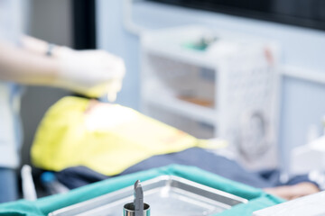 Wall Mural - Blurred image photo of dentist  working in clinic.