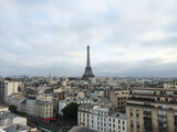 Fototapeta Boho - Paris skyline and Eiffel Tower on a cloudy day with thick clouds.