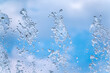 © Dmitrii Potashkin - Splashes of water against the blue sky background