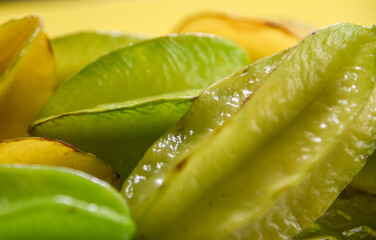 Fresh carambola fruits (Averrhoa carambola) in photo with selective focus.