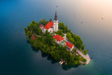 Wall Mural - Bled, Slovenia - Aerial view of beautiful Lake Bled (Blejsko Jezero) with the Pilgrimage Church of the Assumption of Maria on a small island with Pletna boats and small boats on the water at summer 