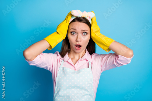 Close-up portrait of her she nice attractive pretty amazed astonished maid bad news reaction hard job miss deadline isolated over bright vivid shine vibrant blue color background