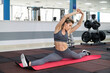 © Anatoly Repin - young woman stretching exercising in fitness club