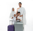© Odua Images - beautiful muslim family hajj. parent and children wearing white for pilgrim