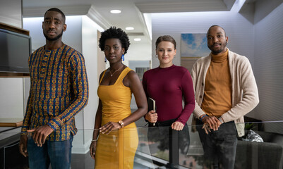 Wall Mural - Confident group of diverse young businesspeople standing in an office