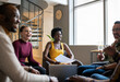 © JonoErasmus - Diverse businesspeople laughing during an office meeting together