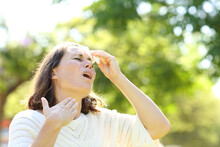 Adult Woman Sweating Suffering Heat Stroke In The Park