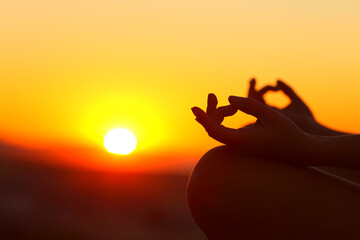 Poster - Woman hands silhouette doing yoga at sunset