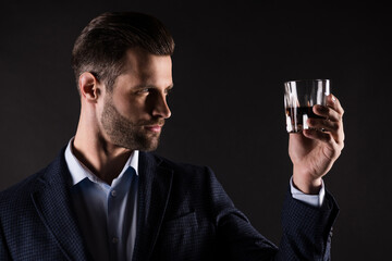 Poster - Close-up portrait of his he nice attractive content guy employer partner leader drinking old expensive luxury brandy cognac corporate occasion isolated on dark black color background