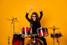 Photo Of Popular Rocker Redhair Lady Plays Instruments Beat Raise Hands Drum Sticks Concert Sound Check Repetition Wear Black Leather Outfit Sun Glasses Isolated Yellow Background