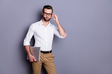 Poster - Portrait of successful reliable man marketer real estate agent hold laptop touch spectacles ready work distance wear good look outfit isolated over gray color background