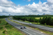 The Bruce Highway In The Early Morning Making Its Way South To Brisbane Past The Glasshouse Mountains. Queensland, Australia.