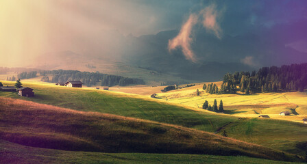 Fototapeta Fantastic alpine valley Alpe di Susi early in the morning. Italya, Dolomites Alps, Europe. Colorful misty morning view. fairytale mountain valley under sunlit. Amazing Nature background.  Wild area
