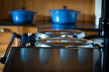 Blue Cast Iron Pots And Pans In A Kitchen