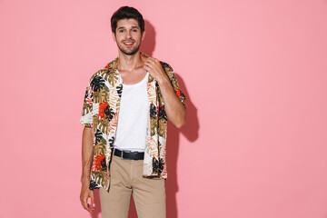 Poster - Portrait of cheerful young man smiling and posing on camera