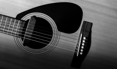 Black and white of detail of acoustic guitar