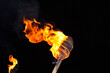 Burning flame torch in night during an event