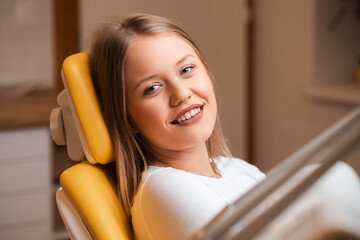 Beautiful young blonde women at dentist with beautiful smile