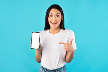 Wall Mural - Girl showing white blank cell phone screen