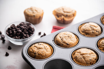 Canvas Print - chocolate chip muffin on white wooden board