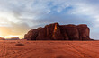 © Alberto Lopez/ADDICTIVE STOCK - Amazing view of red sand desert landscape with rocky mountain during hot dry day in bright sunlight with cloudy blue sky