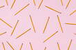 © Dani Enamorado/ADDICTIVE STOCK - Top view of seamless background of pencils chaotically scattered on pink surface